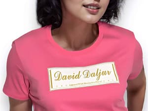 Woman wearing a pink t-shirt with a text design.