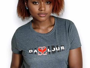Young woman with red hair wearing a gray T-shirt with a heart design.