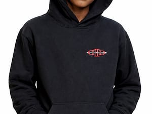 Person wearing a black hoodie with a small red and white design on the chest.