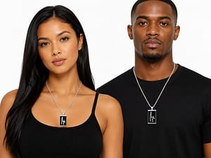 A woman and a man is posing with a signature name tag chain.